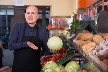 sellers offering fresh cabbage in the market