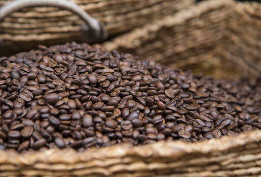 roasred coffee beans in wicker basket