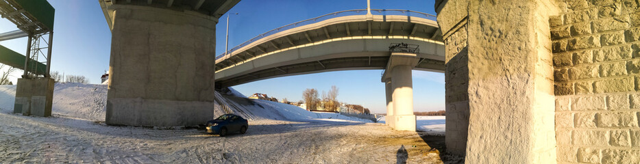 Fototapeta na wymiar Two bridges over the river Sozh in winter