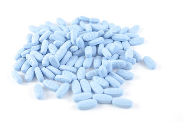 Fototapeta na wymiar Blue pills on white background 
