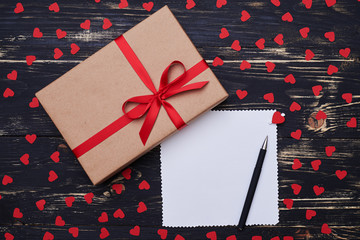 Fototapeta premium Love conception of gift box with blank greeting card on the back