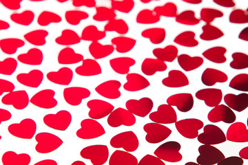 Valentines day pattern of red hearts confetti on white background. Festive Valentine.