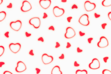 Valentine's day  decorative soft blur abstract pattern of red hearts confetti  on white background. Festive valentine backdrop.