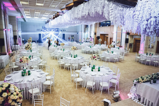 Look from above at large restaurant's hall prepared for wedding