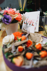 Violet round box with orange roses