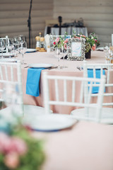 Look over white chair at dinner table with number 2 in silver fr