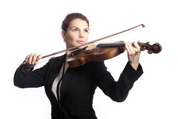 classical brunette beauty in suit plays the violin in studio