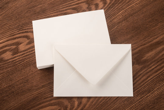 Envelope and business cards on a wooden background 
