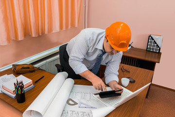 Architect is working on a sketch of the architectural plan