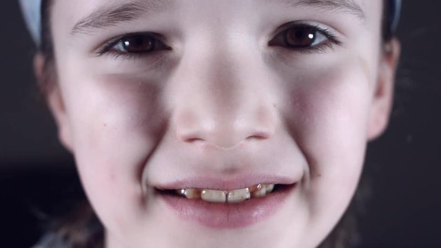 4k Close Up Child Mouth Eating Chocolate and Teeth are Dirty