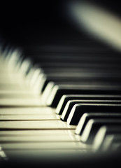 Piano keys, imitation of old photos with grain, selective focus,