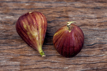 Whole fresh figs on rustic vintage wooden table