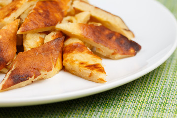 Home made Kaiserschmarrn on white plate, closeup, low focus