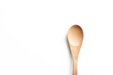 Wooden spoon on white background