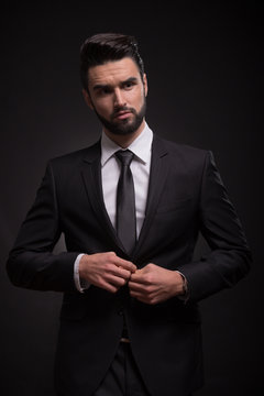 serious young man black suit