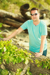 Man spending free time outside, looking at nature