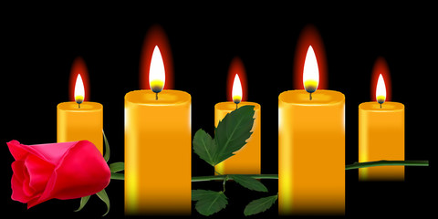 rose and  candles on black background