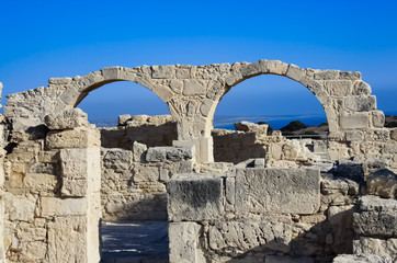 Beautiful scenery of the ruins of arches on a rock by the sea. / Ruins by the sea / Curion, Cyprus