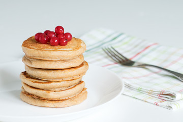 Pancakes with a whole wheat crust with red currant berries