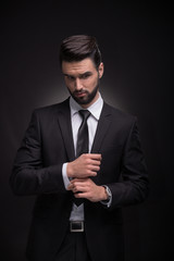 young man elegant suit cufflinks hands