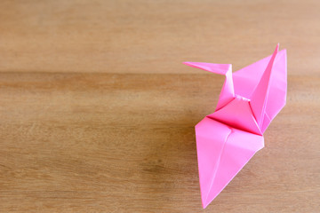 single pink paper origami  crane