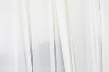 White curtain backdrop with light.