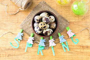 Spring and Easter composition with quail eggs  on wooden table