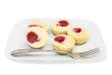 Cheesecakes on a plate with a fork