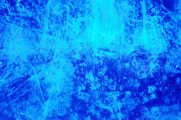 background made of ice illuminated in blue