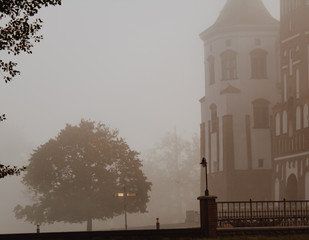 Fototapeta premium Mir Castle at dawn, on the background of beautiful scenery. Mir city, Belarus. / Mir Castle at sunrise