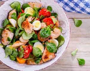 Chicken salad with vegetables and eggs.