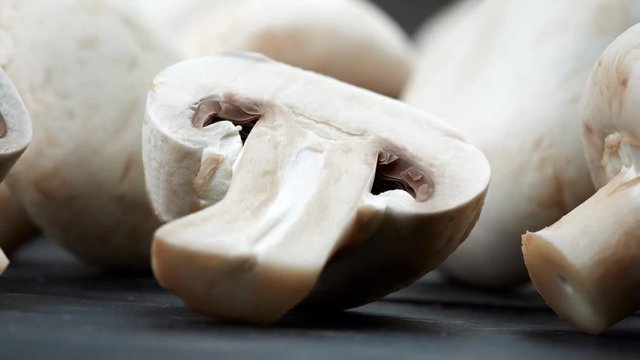 Champignon on black wooden background