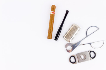 Object photography of a cigar,a  lighter, a cigarette holder and