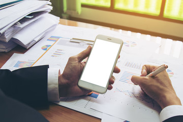 Businessman working check business report. The blank screen with copy space for your text or advertising content. Selective focus and soft flare filter.