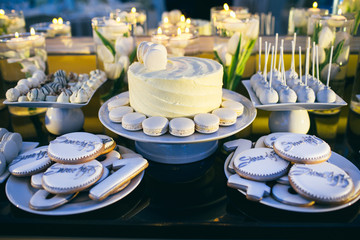 The buffet table with cake and biscuits