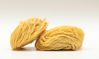 Balls of uncooked noodle tightly bunched