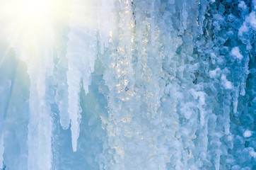 blue ice and frozen icicles, winter background