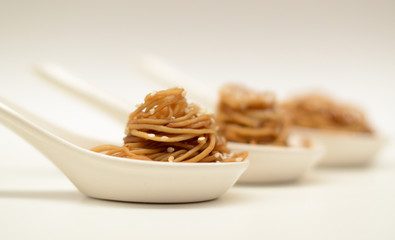 Ramen noodles served in spoons