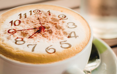 Close-up of Coffee,Cappuccino coffee cup with clock