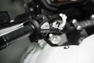 Close up of handlebar with a horn symbol showing on the horn pad