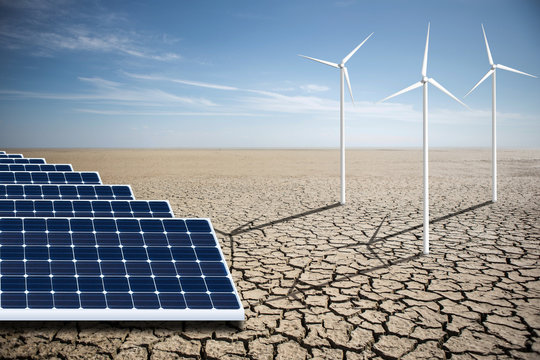 Wind generators and solar panels in the desert. Renewable energy sources. Concept