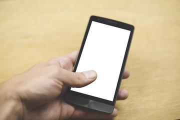 Human hand holding an smatphone with a blank screen