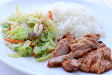 stir fried vegetables and Grilled chicken breasts with thai jasmine rice in white dish isolated on white background. Thai style Food.