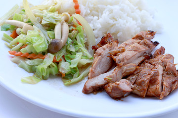 stir fried vegetables and Grilled chicken breasts with thai jasmine rice in white dish isolated on white background. Thai style Food.