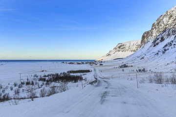Fototapeta na wymiar Winter road near Unstad on Lofoten archipelago, Nordland, Norway