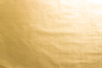 Gold wrinkled paper texture abstract background