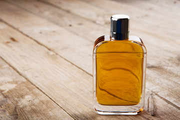perfume bottle on the wooden background