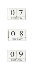 Closeup group of white wooden calendar with black 7 , 8 , 9 february word , three date calendar isolated on white background