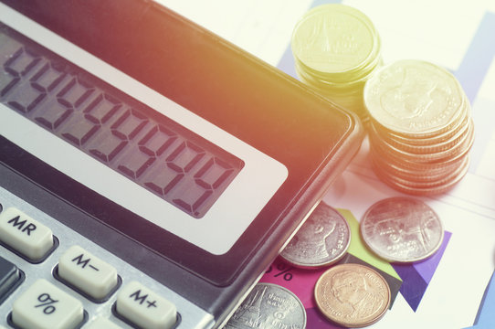 conis and calculator on finance paper, concept in loan, account and growth of business