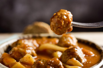 spanish albondigas con sepia, meatballs with cuttlefish